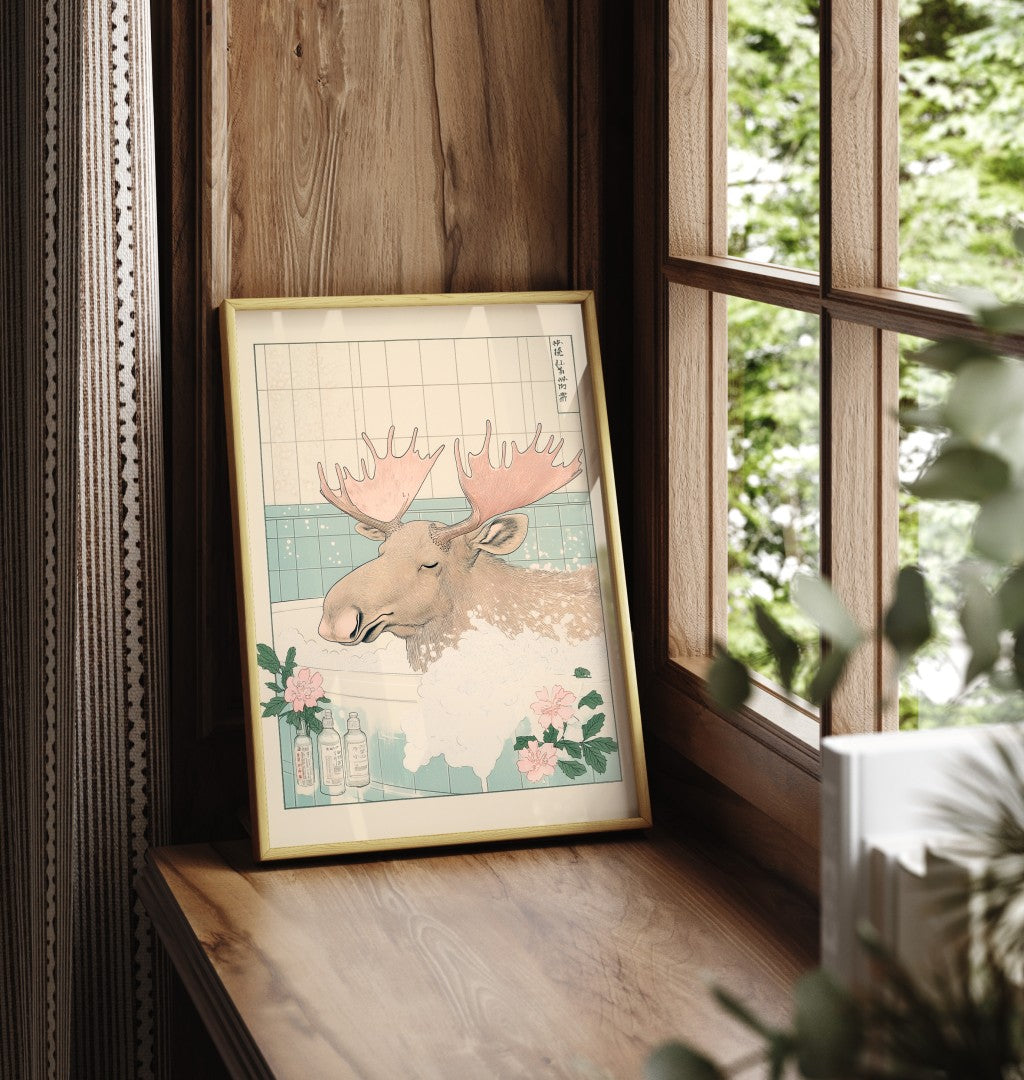 Framed bathroom print showing a moose in soft flower-filled water