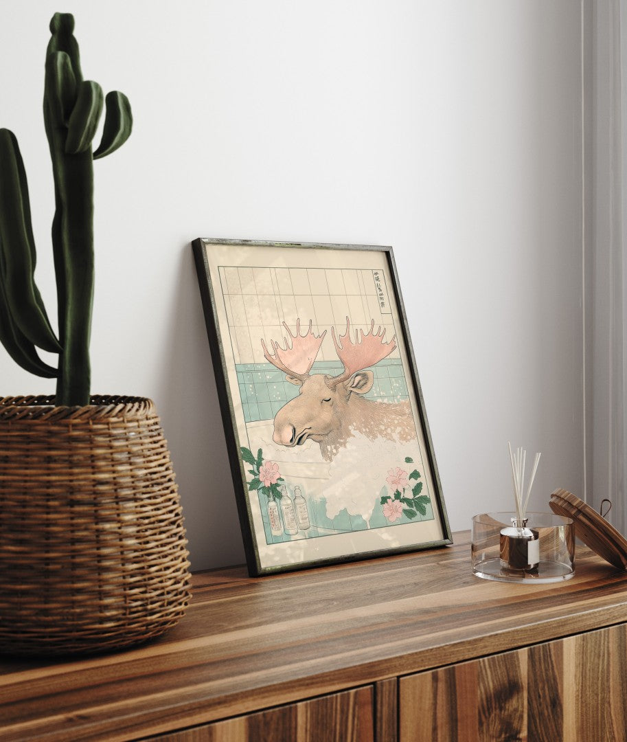 Framed bathroom decor featuring a calm moose in a floral soak