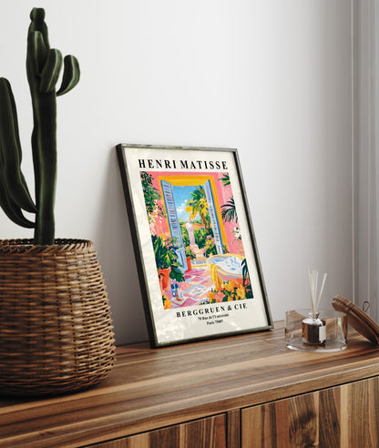 Framed bathroom art print featuring colorful bathtub scene with lush garden and classical sculpture