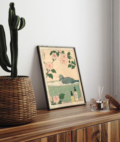 Framed bathroom decor showing a pigeon in a calming Japanese-style soak